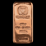 A rectangular copper cast bar with the Germania Mint branding, including an emblem and text indicating the fineness and weight of the bar. 1 kilo