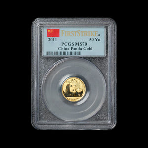 Chinese Gold coin in a protective holder with 'First Strike' and 'PCGS MS70' labels on a black background