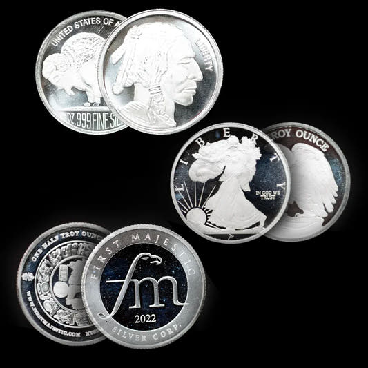 Collection of silver coins with 'First Majestic Silver Co.' branding on a black background