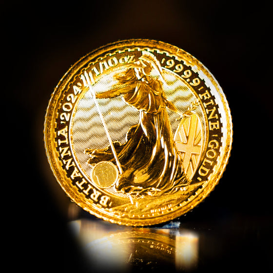 A close-up image of a gold coin with the inscription 'BRITANNIA' and the year '2023', indicating it is the 1/10 oz Great Britain Gold Britannia Coin.