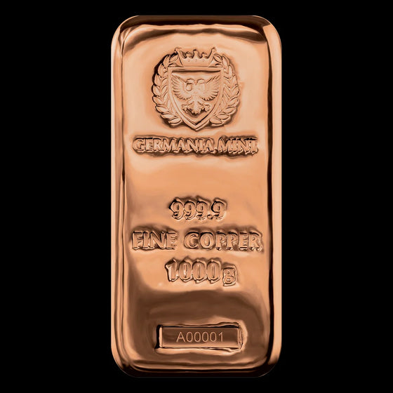 A rectangular copper cast bar with the Germania Mint branding, including an emblem and text indicating the fineness and weight of the bar. 1 kilo