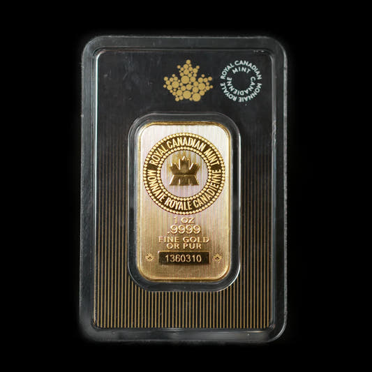 A 1oz Royal Canadian Mint gold bar in its packaging, featuring the mint's logo and the inscription 'Fine Gold 999.9' on the front.
