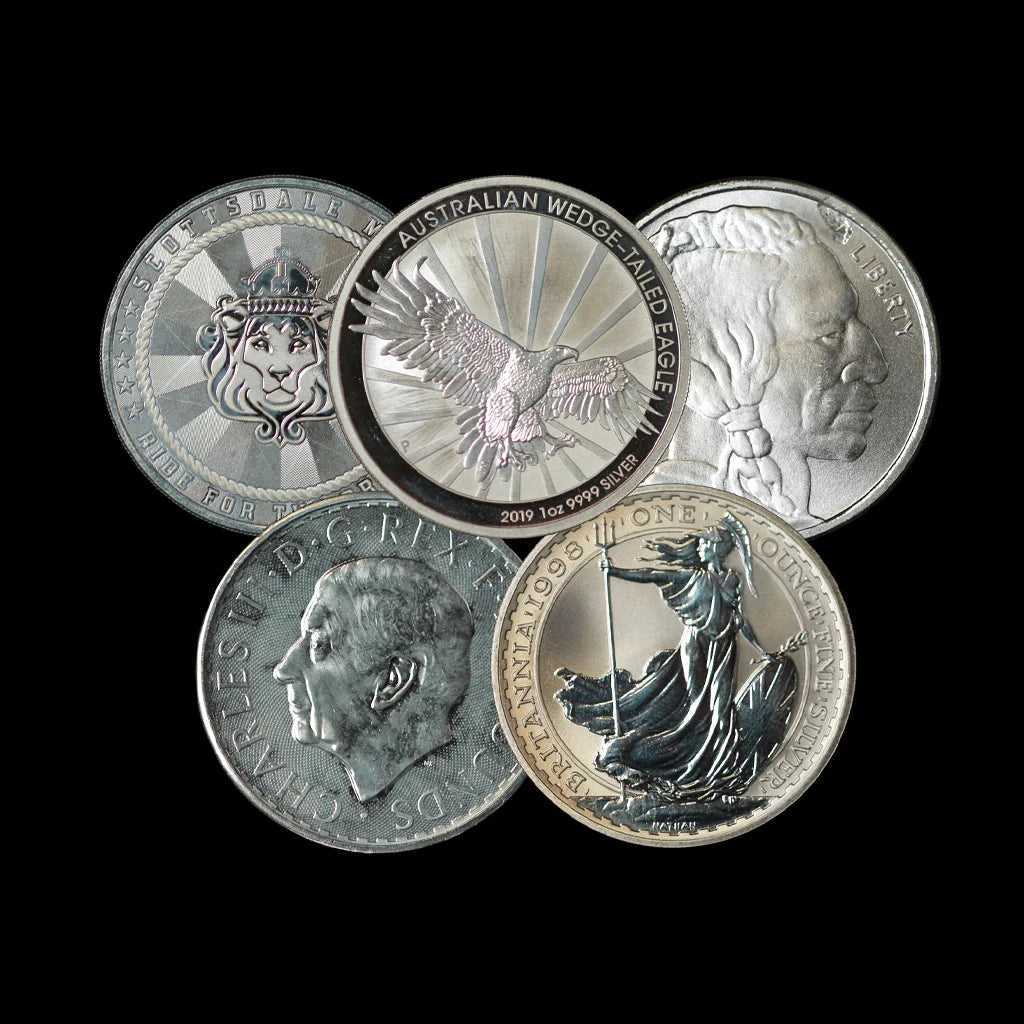 Five silver coins with different designs on a black background